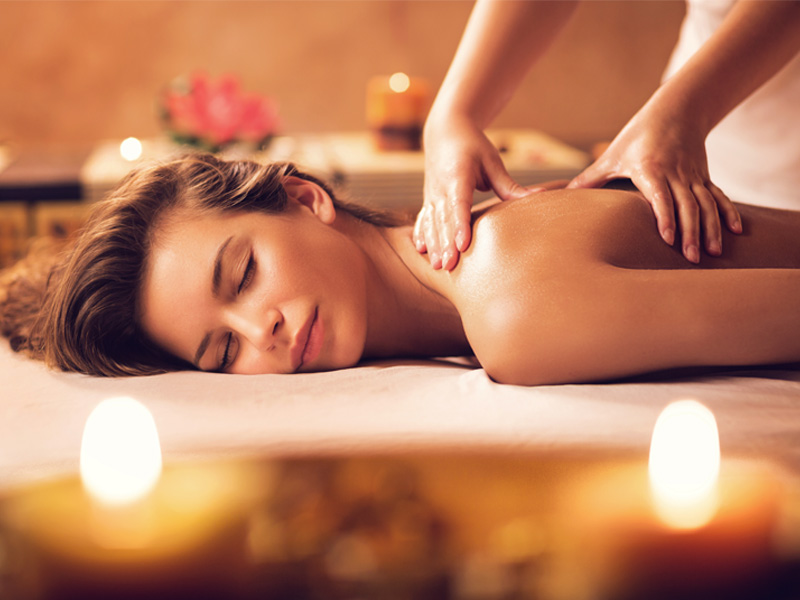 Woman getting massage therapy on her shoulder